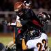 Milan junior quarterback Robert Kanitz is tackled by Tecumseh senior John Terry on Friday. Daniel Brenner I AnnArbor.com